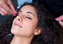 Woman in threading operation - Eyebrow threading in San Ramon, CA